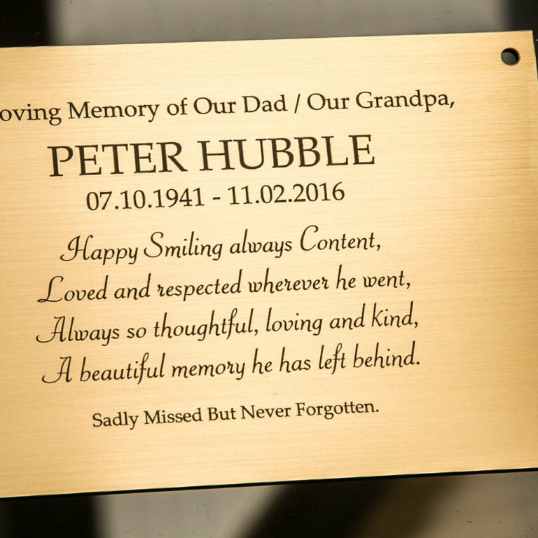 Memorial plaque showing laser engraving onto brass